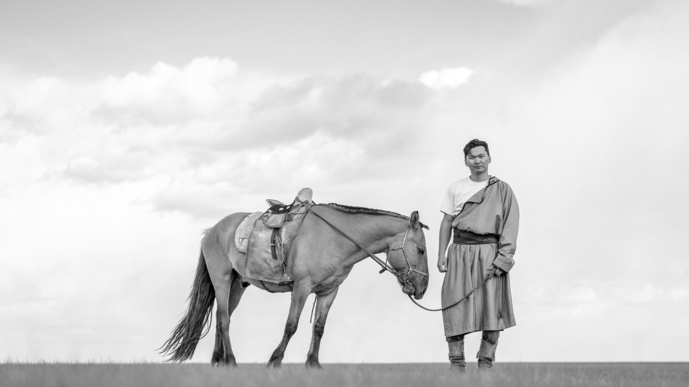 Bilgudei Gankhulug with his horse on the steppe