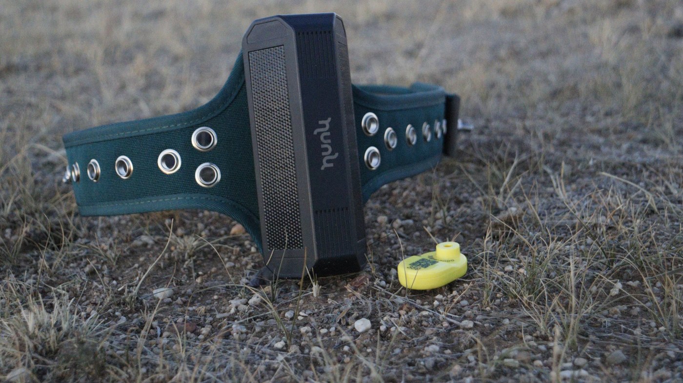 Hunu smart ear tag next to the GPS tracker on the steppe